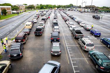 More than 3,000 vehicles lined up at Northeast Early College High School in Austin on April 4 to pick up boxes of food.